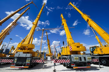 3 yellow franna cranes on a Sydney construction project