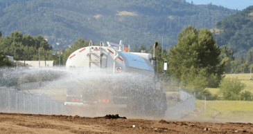 water cart spraying waster for dust control on a brisbane site 
