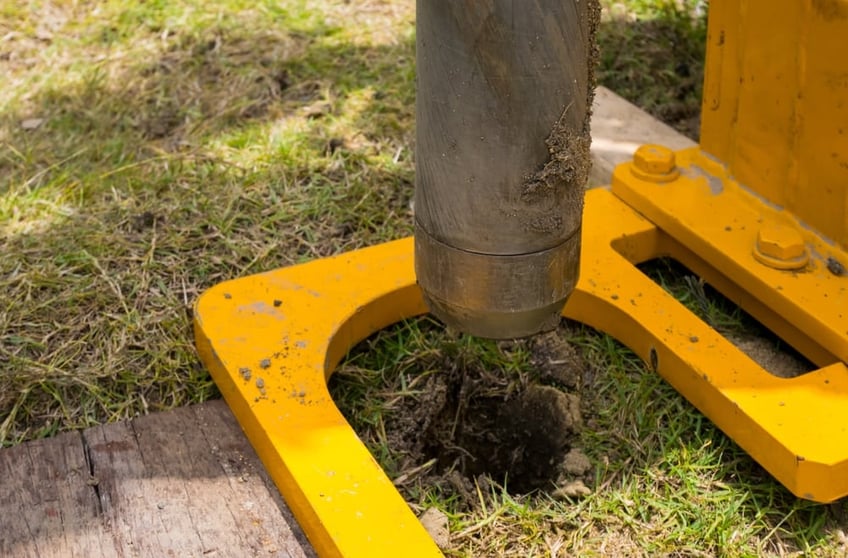 Auger being used to take soil sample 