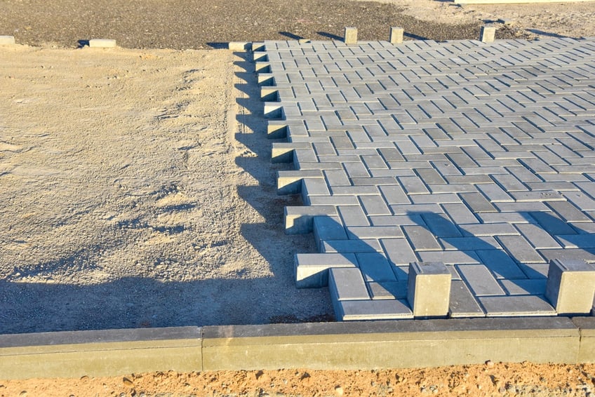 Grey crusher dust under concrete pavers