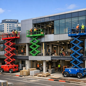 Scissor lifts working on a Newcastle commercial building façade and fit-out