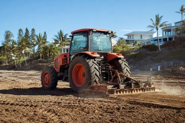 Mid-sized tractor working on a Sunshine Coast civil or landscaping site